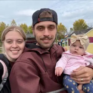 Young man with his baby enjoying a meal at Big Sal’s Pizzeria & Restaurant